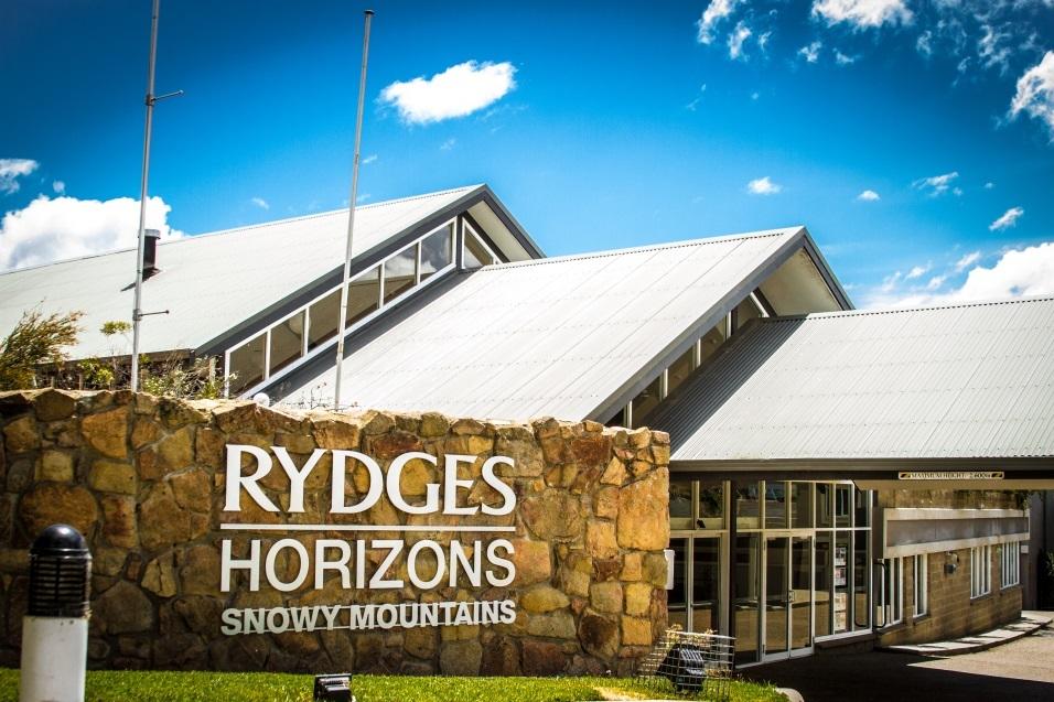 Hotel facade with main sign reading 'RYDGES HORIZONS SNOWY MOUNTAINS'